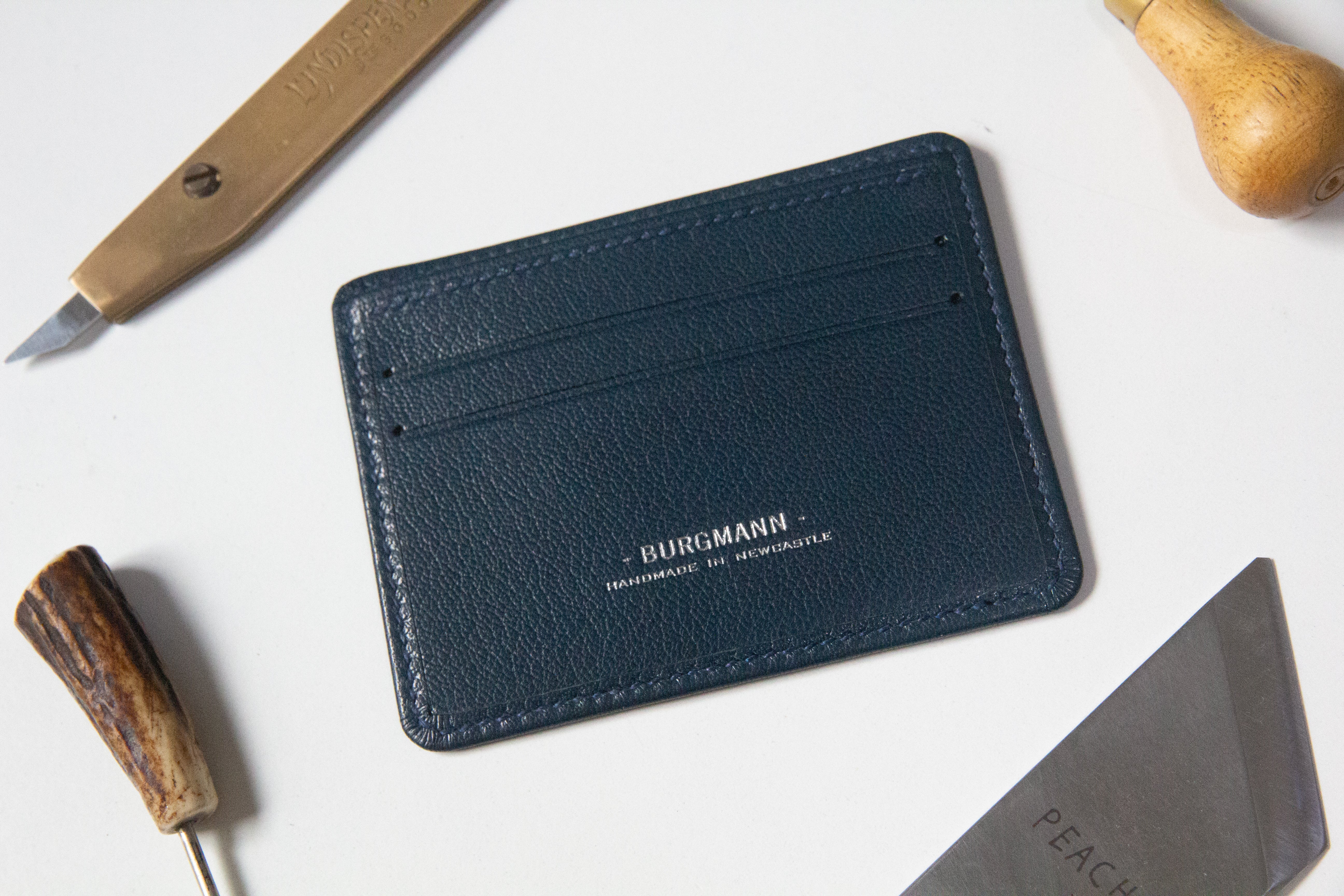 Slim 3 pocket card wallet, front, Also shows some tools for making the wallet